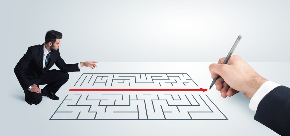 A Businessperson examining a hand-drawn maze — Chapter 11 reorganization complexity.