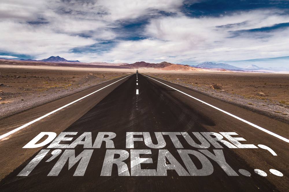 A long road in the desert with the words 'Dear Future, I'm Ready' painted on the pavement — representing the founder's decision moment that triggers an ESOP transaction.